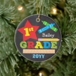 1st Grade First Grade Keepsake Chalkboard Colourfu Ceramic Ornament<br><div class="desc">This first grade ornament features a star, a ruler, a pencil, crayons and bold, colourful fun typography! Click the customise button for more options for modifying the text! Variations of this design, additional colours, as well as coordinating products are available in our shop, zazzle.com/store/doodlelulu. Contact us if you need this...</div>