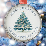 2024 Personalised Blue Watercolor Christmas Tree Metal Ornament<br><div class="desc">This holiday ornament features a blue watercolor Christmas tree decked with ribbons and ornaments. The words "Merry Christmas" appear in blue serif font,  with your family's name and the year below.</div>