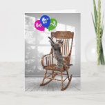 21st Birthday Cat With Balloons   Card<br><div class="desc">Playful tabby cat standing on a wooden rocking chair and reaching for a colourful balloon bouquet for 21st birthday.
Age number can be changed.</div>