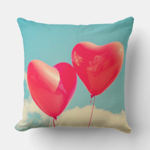 2 Bright Red Heart Shaped balloons Floating Upward Cushion