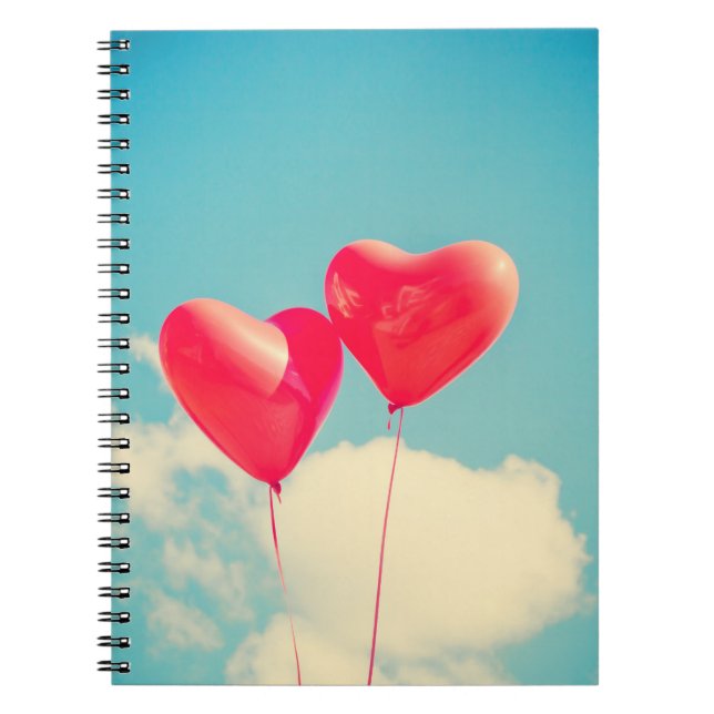 2 Bright Red Heart Shaped balloons Floating Upward Notebook (Front)