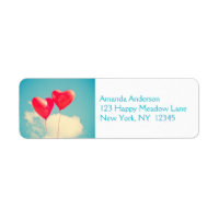2 Bright Red Heart Shaped balloons Floating Upward