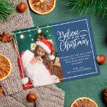 2 family photos blue Believe in Christmas magic Holiday Postcard<br><div class="desc">Modern holiday greeting postcard featuring one of your favourite Christmas family portraits on the left complemented by a real gold foil frame and wording that reads "Believe in the magic of Christmas" on the right over a classic blue background, customisable with your own greeting message. The back of the postcard...</div>