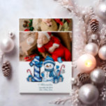 2 Photo Blue Snowman First Christmas Holiday Card<br><div class="desc">Celebrate your little one’s first holiday season with this cheerful winter design featuring a blue plaid number,  adorable snowman,  and scattered candy canes and gifts. Customise it with your baby's photo and birth details to create a keepsake that brings charm and magic to your holiday memories.</div>
