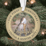 2 Photo First Christmas Engaged Black & Faux Gold Ornament<br><div class="desc">Celebrate the joyful 1st holiday of your engagement with a custom 2 photo "Our First Christmas Engaged" black and gold round acrylic ornament. All text and images on this template are simple to personalise and can be different or the same on front and back. (IMAGE & TEXT DESIGN TIPS: 1)...</div>