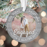 2 Photo First Christmas Engaged Grey Faux Wood Ornament<br><div class="desc">Celebrate the joyful 1st holiday of your engagement with a custom 2 photo "Our First Christmas Engaged" faux grey wood round acrylic ornament. All text and images on this template are simple to personalise and can be different or the same on front and back. (IMAGE & TEXT DESIGN TIPS: 1)...</div>