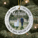 2 Photo Our First Christmas Married Faux Marble Ceramic Ornament<br><div class="desc">Celebrate a joyful 1st holiday as Mr. & Mrs. with a custom 2 photo "Our First Christmas Married" round ceramic ornament. All text and images on this template are simple to personalise. As an idea, the script typography can read "Together" or "Engaged." (IMAGE & TEXT DESIGN TIPS: 1) To adjust...</div>