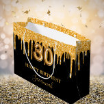30th birthday black gold glitter drips name large gift bag<br><div class="desc">A chic black background. Decorated with faux gold glitter drips,  paint dripping look. Personalise and add a name.  With the text:  Happy Birthday.  The name is written with a mode hand lettered style script.   Number 30 is written with a balloon style font.</div>