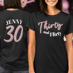 30th birthday thirty flirty pink silver name T-Shirt<br><div class="desc">Thirty and flirty, 30th birthday glitter style effect thirty script text in rose pink and silver hues with with text on dark coloured t-shirt and a number 30 on the reverse and your name. Personalise this 30th birthday shirt with your message and name. Other years and matching items are available....</div>