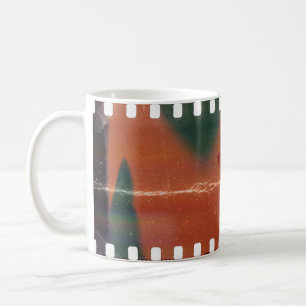 35mm filmstrip start, cool scratches. coffee mug