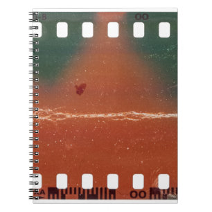35mm filmstrip start, cool scratches. notebook