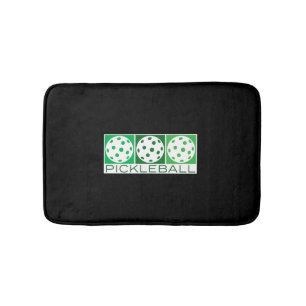 3 Green Pickleballs on white Bath Mat