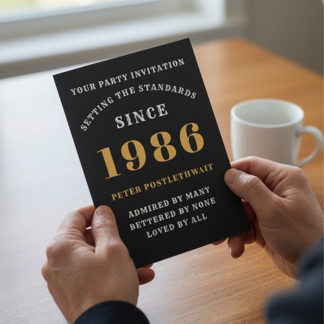 40th Birthday 1986 Black Gold Personalised For Him Invitation (1986 40th birthday invitation held in hands over a table.)