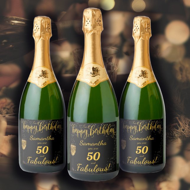 50 and Fabulous Birthday Black and Gold Sparkling Wine Label (50 and Fabulous Birthday Template design in black and gold, a glass of champagne and sparkles... )