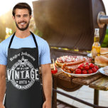 50th Birthday Gift Vintage Aged to perfection 60th Apron<br><div class="desc">Vintage Birthday Apron | Aged to Perfection Limited Edition | 30th 40th 50th 60th 70th Gift for Him or Her Celebrate their milestone in style with our Vintage “Aged to Perfection” Apron, designed by The Arty Apples. Featuring bold white typography on a classic black apron, this design includes a custom...</div>