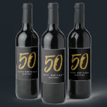 50th birthday party black gold favour wine label<br><div class="desc">Celebrate 50 years with this black and faux gold glitter wine label featuring a large stylised 50. Coordinates with the birthday and anniversary collection by Lea Delaveris Design. Works perfectly for a birthday or anniversary party favours,  table decor or as a gift.</div>