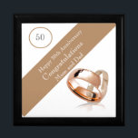 50th Wedding Anniversary  Gift Box<br><div class="desc">This lovely Anniversary gift box is perfect for a couples 50th Wedding Anniversary. The suggested theme for this anniversary is gold. With this in mind I have featured two gold wedding rings in the design with a banner and editable text so it can be made truly personal. Perfect to hold...</div>