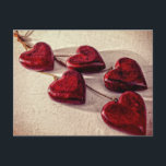 5 Red Wooden Hearts Entwined Together Postcard<br><div class="desc">5 distressed and weathered looking wooden hearts. These deep red hearts are attached to a fine rope and strung together to create a necklace pendant. These dangling hearts sit together on a cream textured background. The heart is a symbol of love,  affection,  romance and passion.</div>