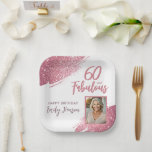 60 and Fabulous Pink Glitter Photo 60th Birthday Paper Plate<br><div class="desc">60 and Fabulous Pink Glitter Photo Surprise 60th Birthday Party Plates. Throw a stunning celebration with these “60 and Fabulous” pink glitter birthday plates. Featuring sparkly faux-glitter brush strokes, and space for a personal photo, this elegant design is perfect for honouring a fabulous woman’s milestone birthday. Fully customisable to include...</div>