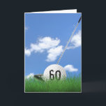 60th birthday golf ball in grass card<br><div class="desc">White golf ball in green grass with golf club and sky background for 60th birthday.
Age number on golf ball can be edited.</div>