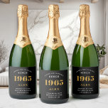 60th Birthday Name 1965 Black Gold Elegant Chic Sparkling Wine Label<br><div class="desc">Vintage Birthday Black & Gold Elegant Label. Celebrate your milestone with our exclusive sparkling wine birthday label. The meticulously designed label with stunning black and gold hues effortlessly enhances the visual appeal of your favourite sparkling wine. The year prominently featured on the label, adds a nostalgic throwback to the year...</div>