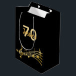 70th Birthday party black gold music notes name Medium Gift Bag<br><div class="desc">Chic black background with faux gold music notes for a 70th birthday. Templates for the age 70 and name.  The name is written in a hand-lettered style script.  Golden letters and number.</div>