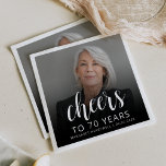 70th Birthday Party Photo White Script Cheers Napkin<br><div class="desc">This custom 70th birthday napkin features the guest of honour's personalised photo,  name,  and birthday,  along with the word "Cheers" in elegant white calligraphy script. A dark screen helps make the text pop. A great way to celebrate someone who's turning seventy!</div>