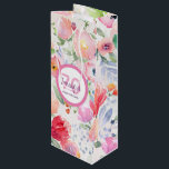 70th birthday pink flowers pastel bohemian style wine gift bag<br><div class="desc">Summer and garden themed design, bohemian, boho style for a 70th birthday. Soft, feminine watercolored flowers in pink and peach colours with green leaves on a white background. A white and pink frame with templates for name, age 70 and date. (date of birth or date of the anniversary) Purple and...</div>