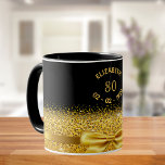 80th birthday black gold classic elegant bow name mug<br><div class="desc">Elegant,  classic,  glamourous and feminine.  A faux gold coloured bow and ribbon with golden glitter and sparkle,  a bit of bling and luxury for a 80th birthday gift or keepsake.  Black background. Templates for her name,  age 80 and date of birth.  Curved text and golden letters</div>