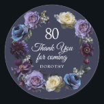 80th Birthday Moody Purple Flower Thank You Favour Classic Round Sticker<br><div class="desc">Say thank you and add a special personalised touch to your favours! Moody and mysterious purple roses and peonies set the tone for this elegant 90th birthday thank you favour sticker. White and blue flowers add a pop of colour to the dark watercolor wreath. A large 80, Thank You for...</div>