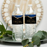 80th Birthday Party Navy Blue Gold Agate Water Bottle Label<br><div class="desc">These chic 80th birthday water bottle labels feature a watercolor image of an agate geode in shades of navy blue with faux gold glitter highlights. The words "80th Birthday" appear in faux gold glitter in a decorative modern handwriting font. Customise it with the name of the guest of honour and...</div>