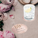 80th birthday rose gold name round paper coaster<br><div class="desc">Elegant,  classic,  glamourous for a 80th birthday party.  Rose gold and blush gradient background. Decorated with rose gold confetti.  Personalise and add a name.   The name is written with a modern dark rose coloured hand lettered style script.   Number 80 is written with a balloon style font.</div>