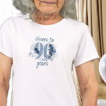 90th Birthday Cheers to 90 Years Floral Number T-Shirt<br><div class="desc">90th birthday t-shirt, which reads cheers to 90 years or you are welcome to edit the wording to personalise as you wish. Design features number 90 decorated with rose buds, flower blooms and foliage in shades of coastal blue and sand. Subtle feminine and elegant design with watercolor floral arrangements, paint...</div>