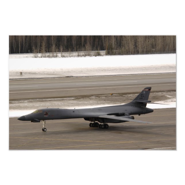 A B-1B Lancer performs a touch and go Photo Print (Front)