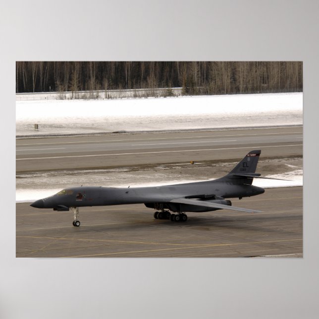 A B-1B Lancer performs a touch and go Poster (Front)