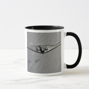 A B-2 Spirit flies over the Pacific Ocean Mug