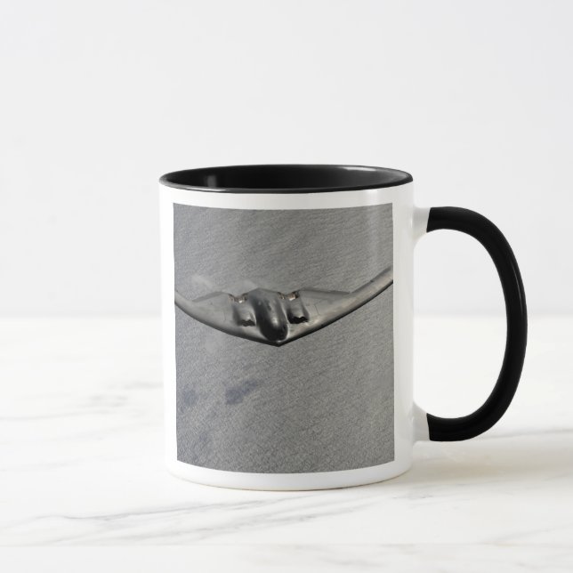 A B-2 Spirit flies over the Pacific Ocean Mug (Right)