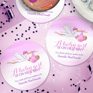 A baby girl is on her way stork pink round paper coaster
