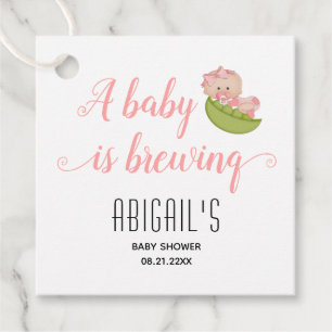 A baby is brewing cute baby girl in pink in a pod favour tags