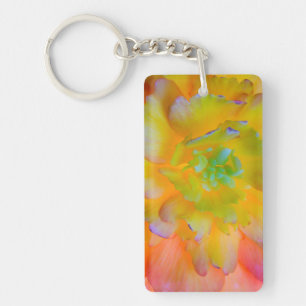 A back-lit, glowing begonia blossom key ring