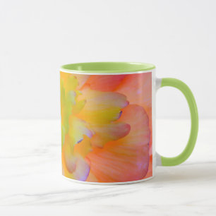 A back-lit, glowing begonia blossom mug