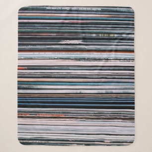 A background consisting of a stack of records in t sherpa blanket