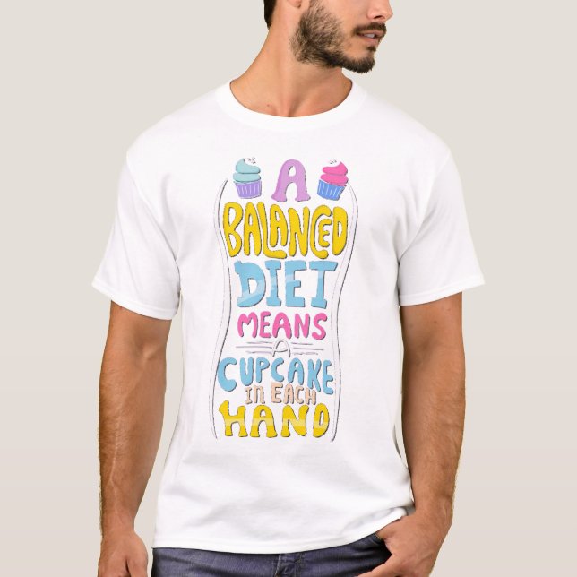 A balanced diet means a cupcake in each hand T-Shirt (Front)