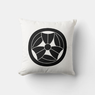 a bamboo leaf that is broken three times in a circ cushion