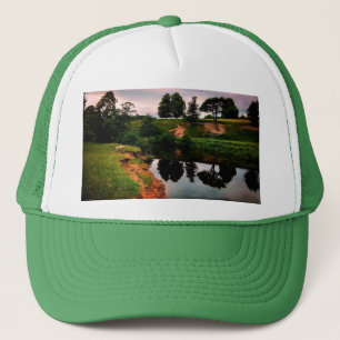 A bank , with reflective trees trucker hat