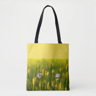 A bee on the Spring wild flowers Tote Bag