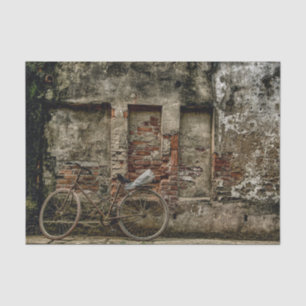 A Bicycle Resting on a Weathered Brick Wall Tissue Paper