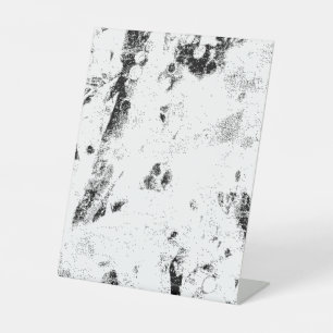 a black and white photo of a black and white photo pedestal sign