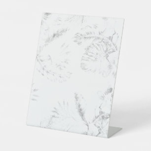 a black and white photo of a white background pedestal sign