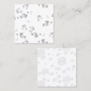 a black and white photo of bubbles on a white back calling card